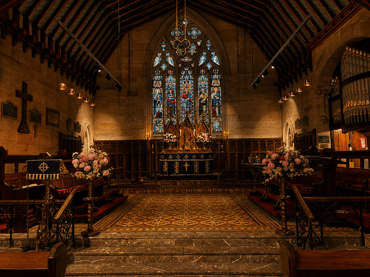 Candlelit historic stone church sanctuary with stained glass and altar